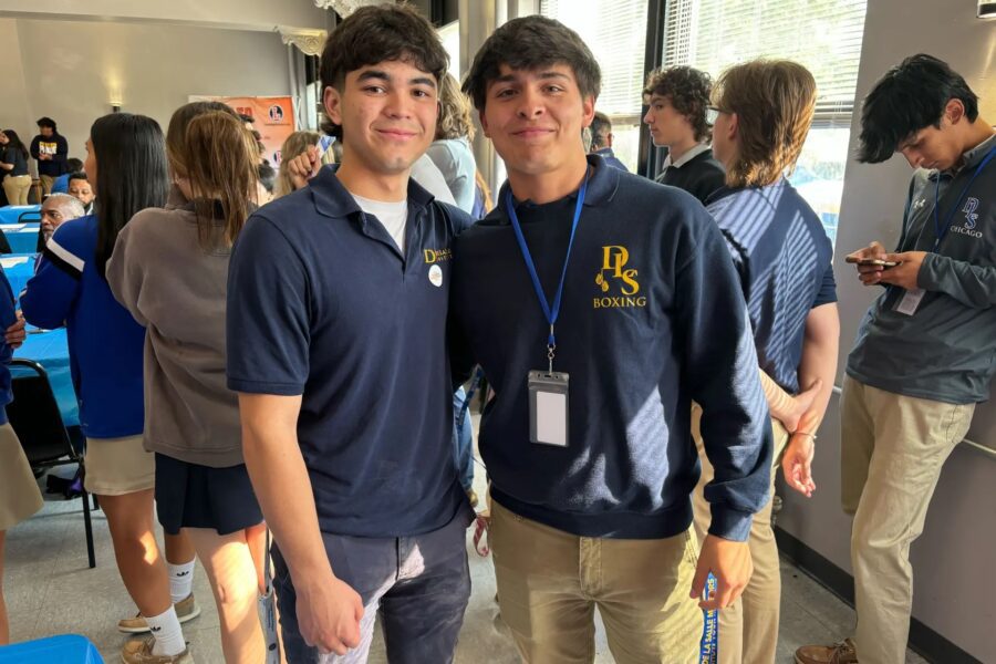 Two young men posing at an event.